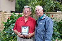 State Fair General Manager Jerry Hammer presentingJohn Cartwright with a People's Choice Award.